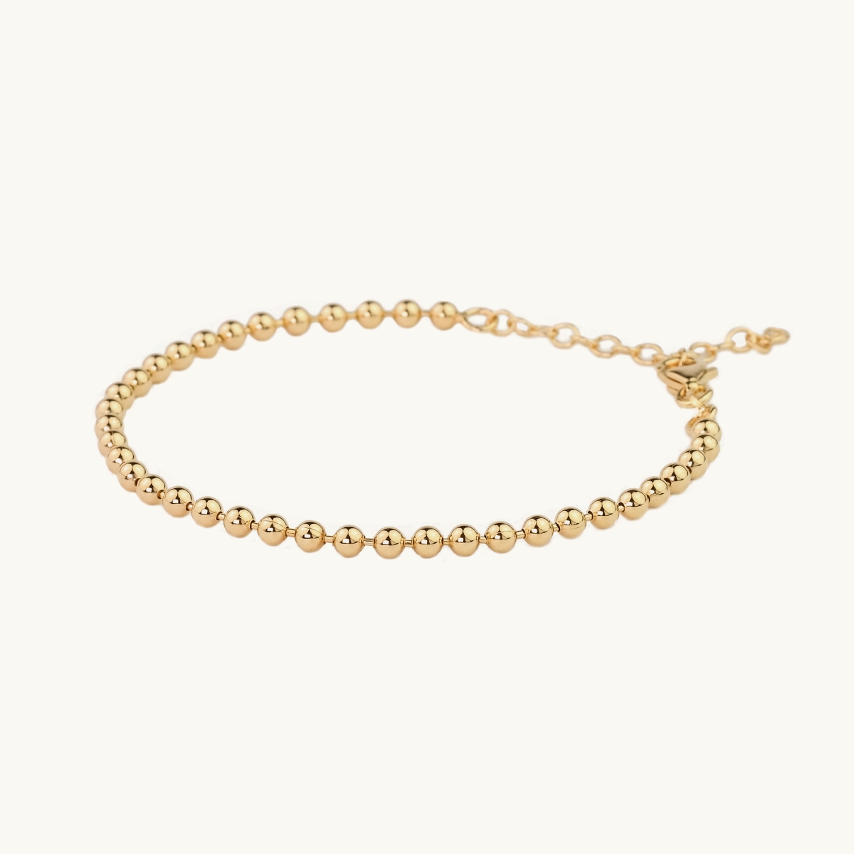 Globe armband i guldfrgylld mssing 