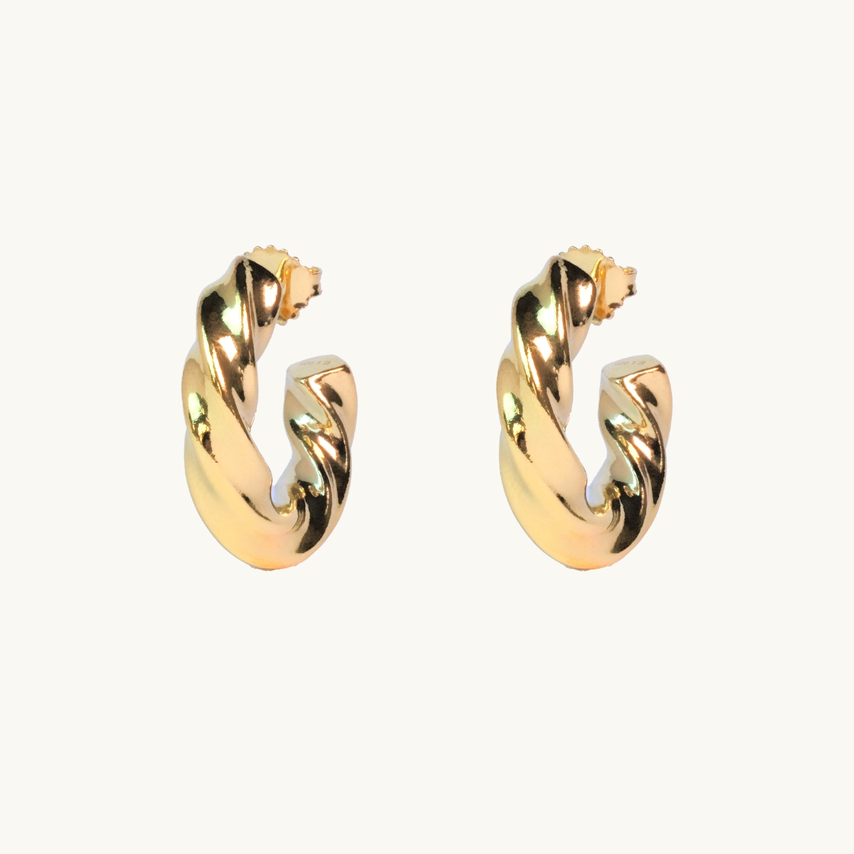 Snurrade hoops i guld