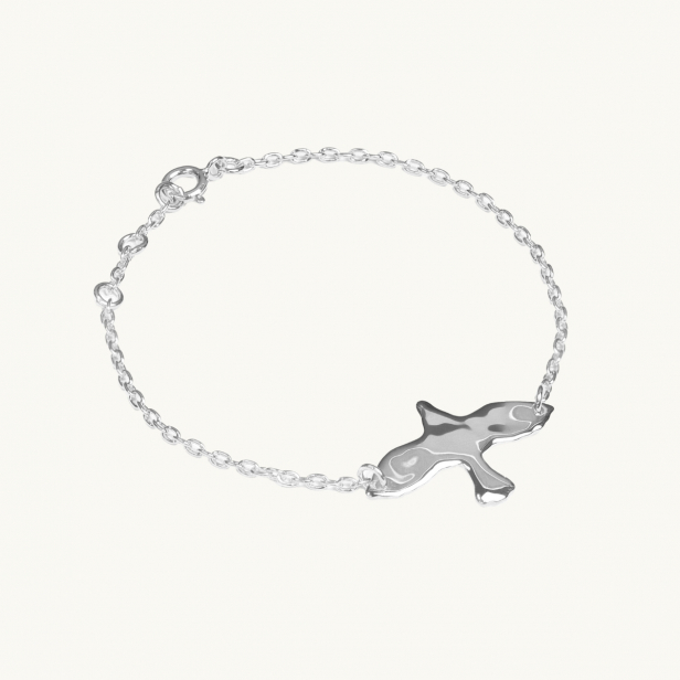 en ojämn duva i armband