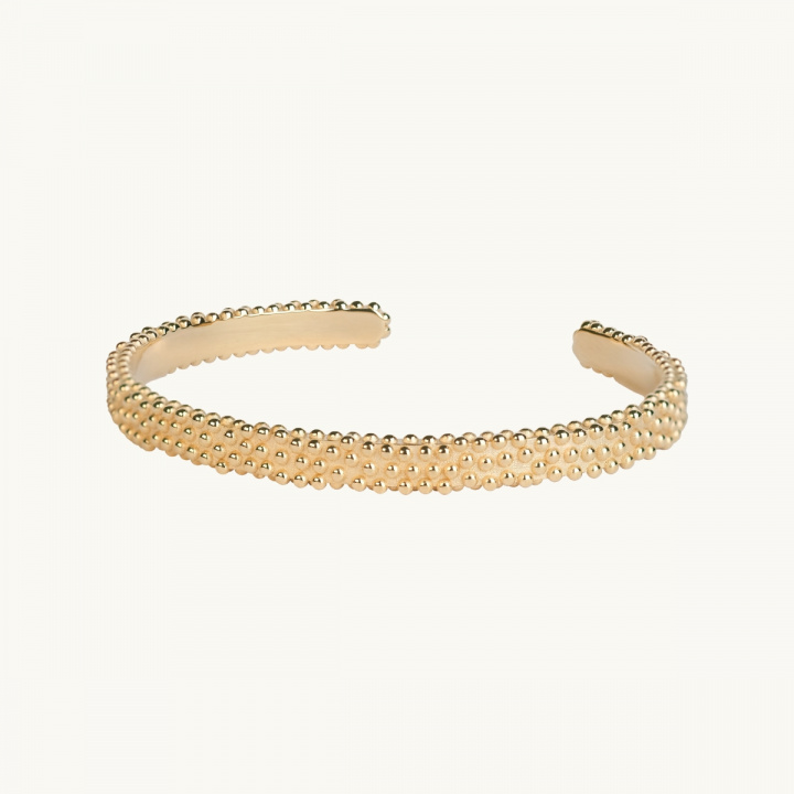 Hårt armband i guldförgylld mässing med ojämn yta