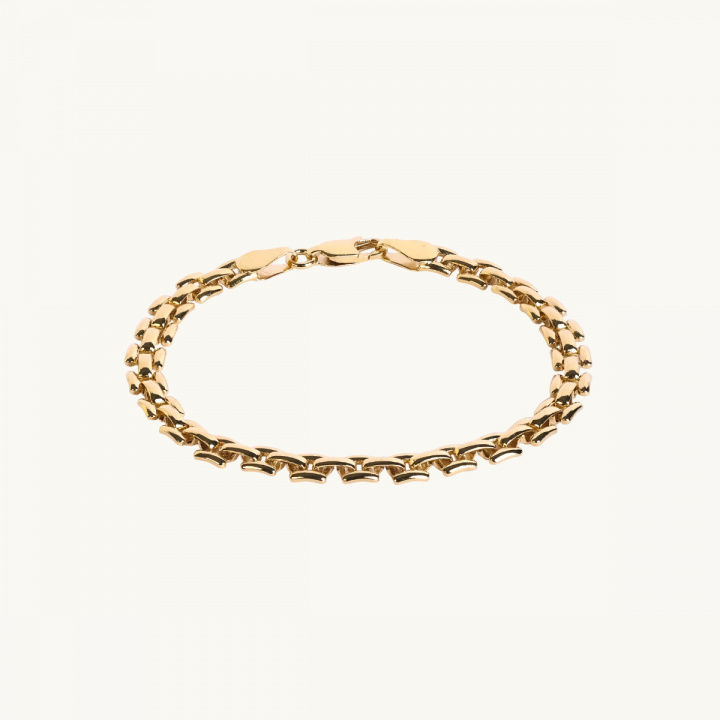 Fint guldarmband med sammanflätade trinity-länkar – smycke från Emma Israelsson.