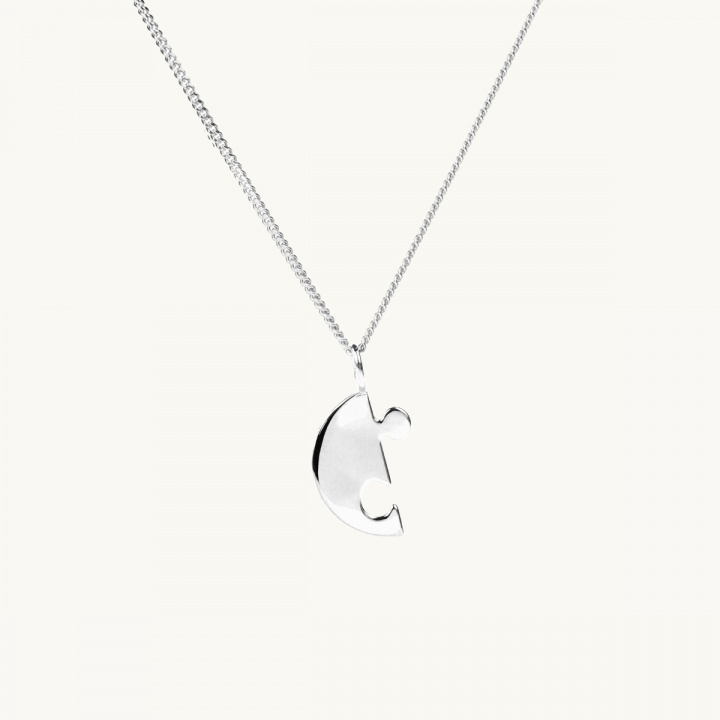 Pusselhalsband i silver, brythjärta