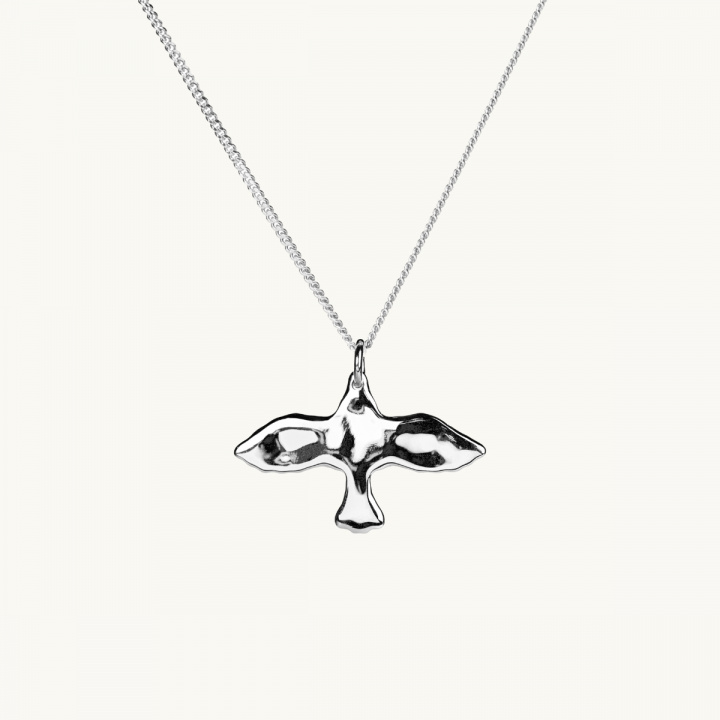 En duva med ojämn yta i sterling silver 
